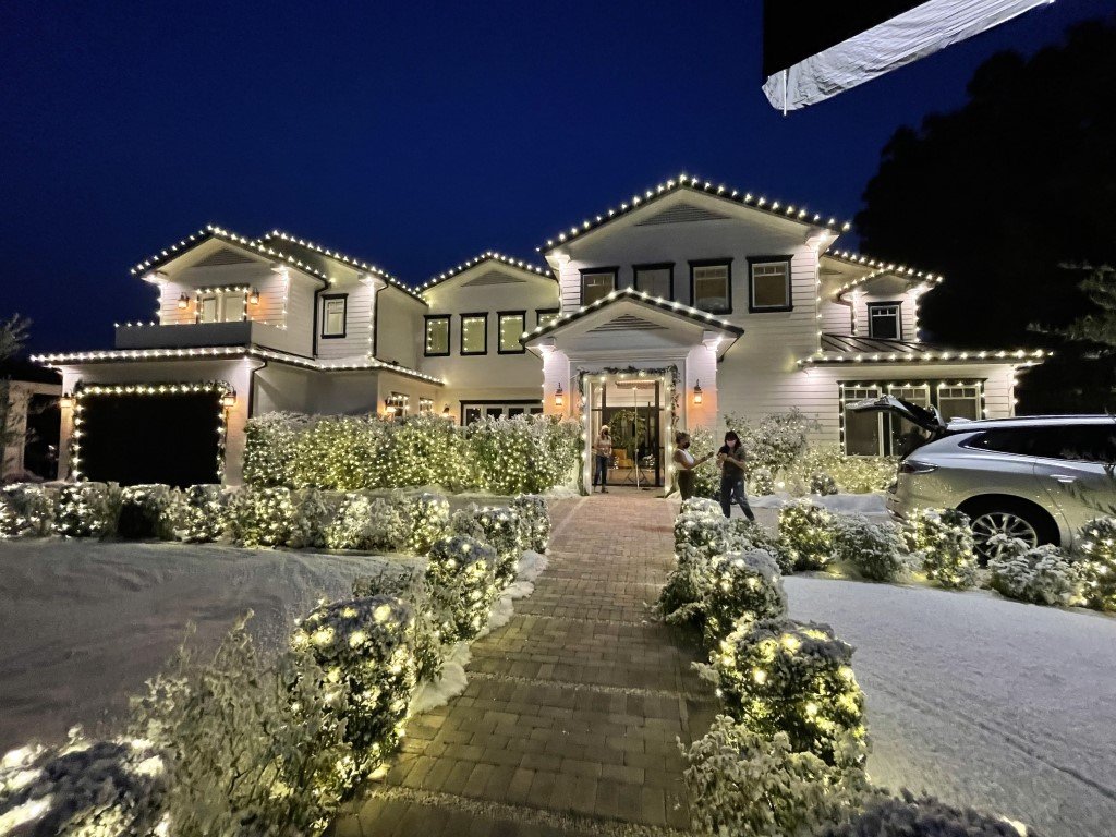 A Bel Air home is decorated in holiday lighting and fake snow after a professional holiday lighting installation by Christmas Brothers